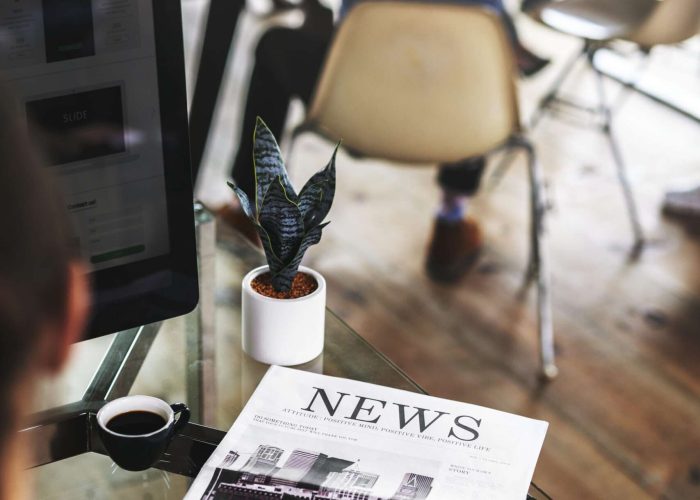 Businessman His Desk With Newspaper